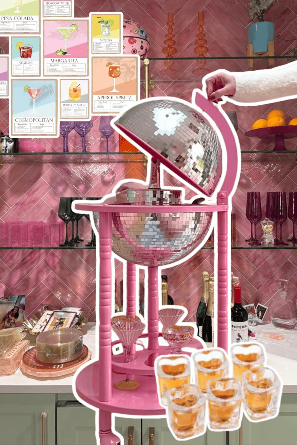 Pink cocktail stand with glasses and desserts, perfect for home hosting and stylish bar decor.