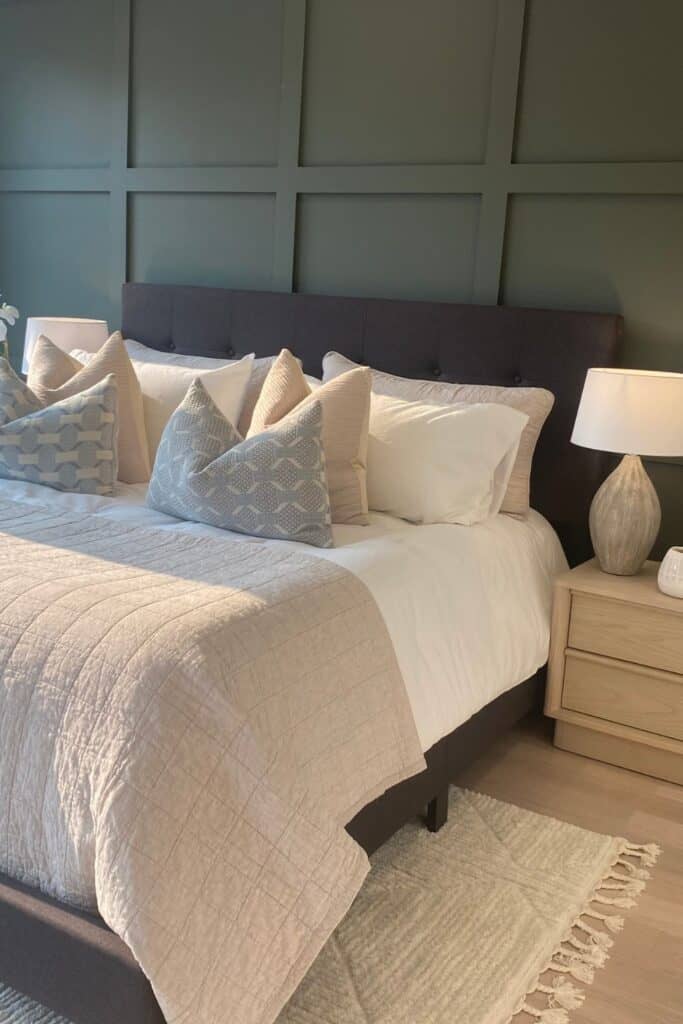 Comfortable bedroom with stylish pillows, soft bedding, and modern decor.